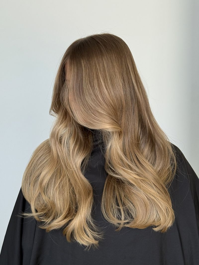 Dimensional caramel bronde blow-dry